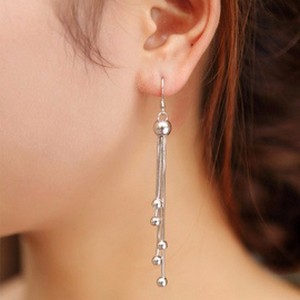 Longues boucles d'oreilles